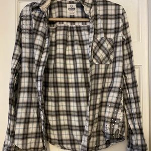 Long sleeved, flannel with rhinestones.